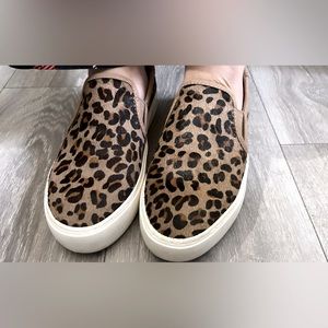 UGG Jass Exotic leopard print calf hair slip on shoes.